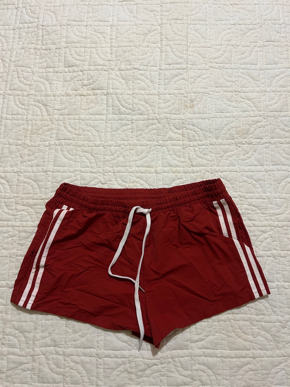 Red Athletic Shorts with White Stripes